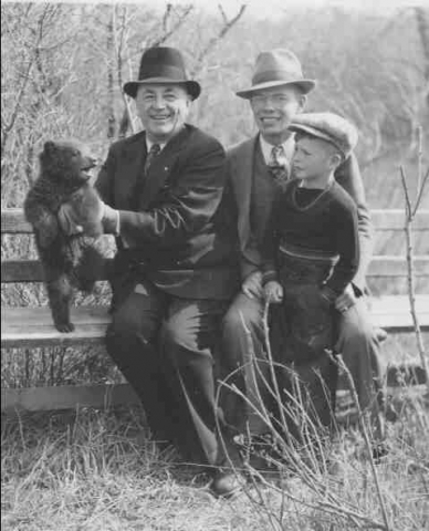 Bob McRitchie, His brother (also a CCI graduate) and Father, receiving a bear cub for the Moose Jaw Wild Animal park. Bobs dad was instrumental in getting the park started.